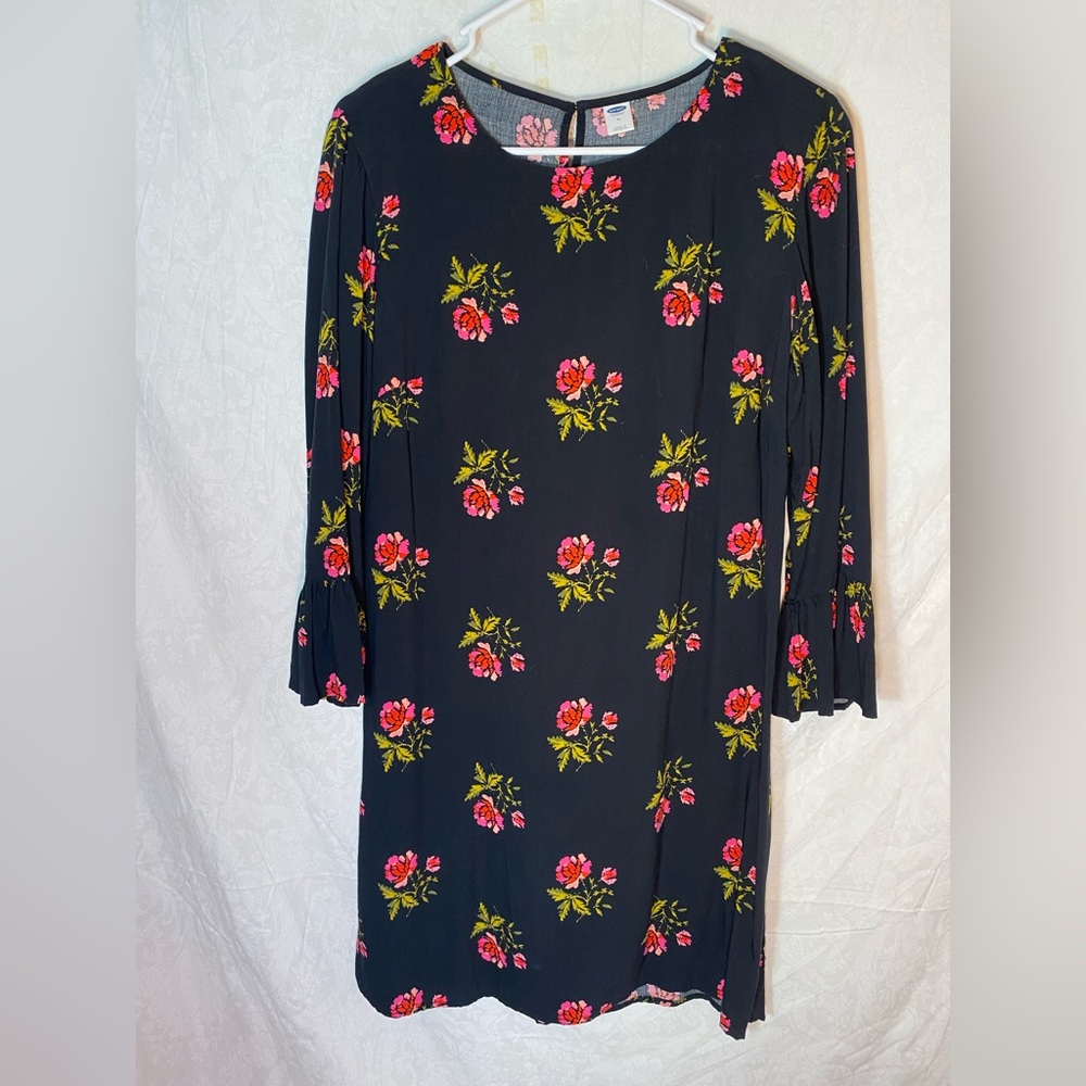 Black dress with floral details.